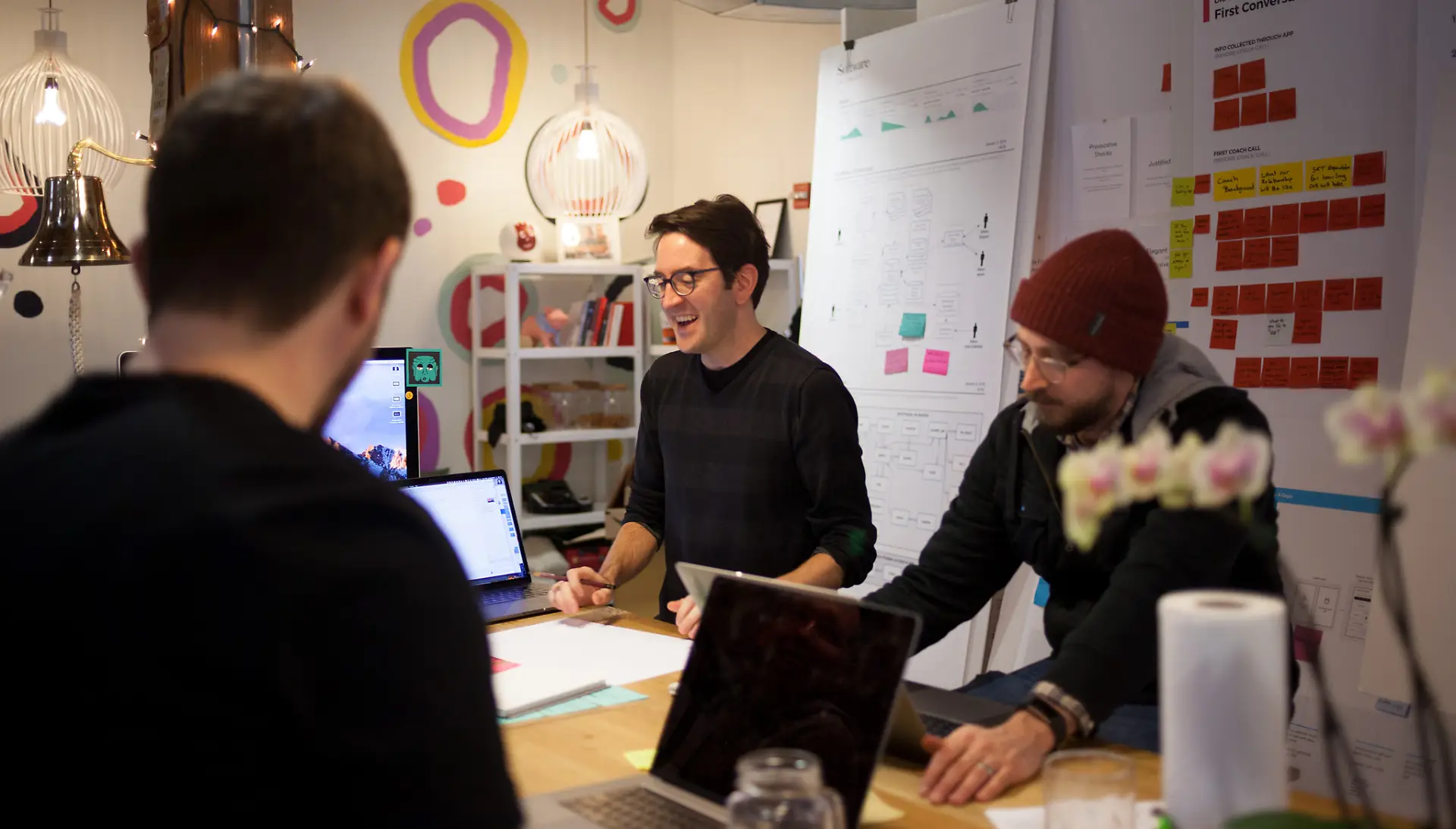 Ben Syverson leading a team meeting in an IDEO project space.